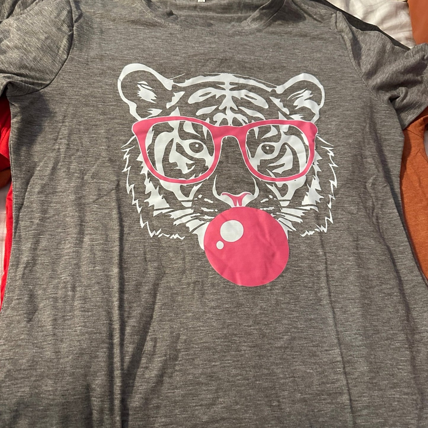 Tiger wearing Glasses blowing a bubble Shirt