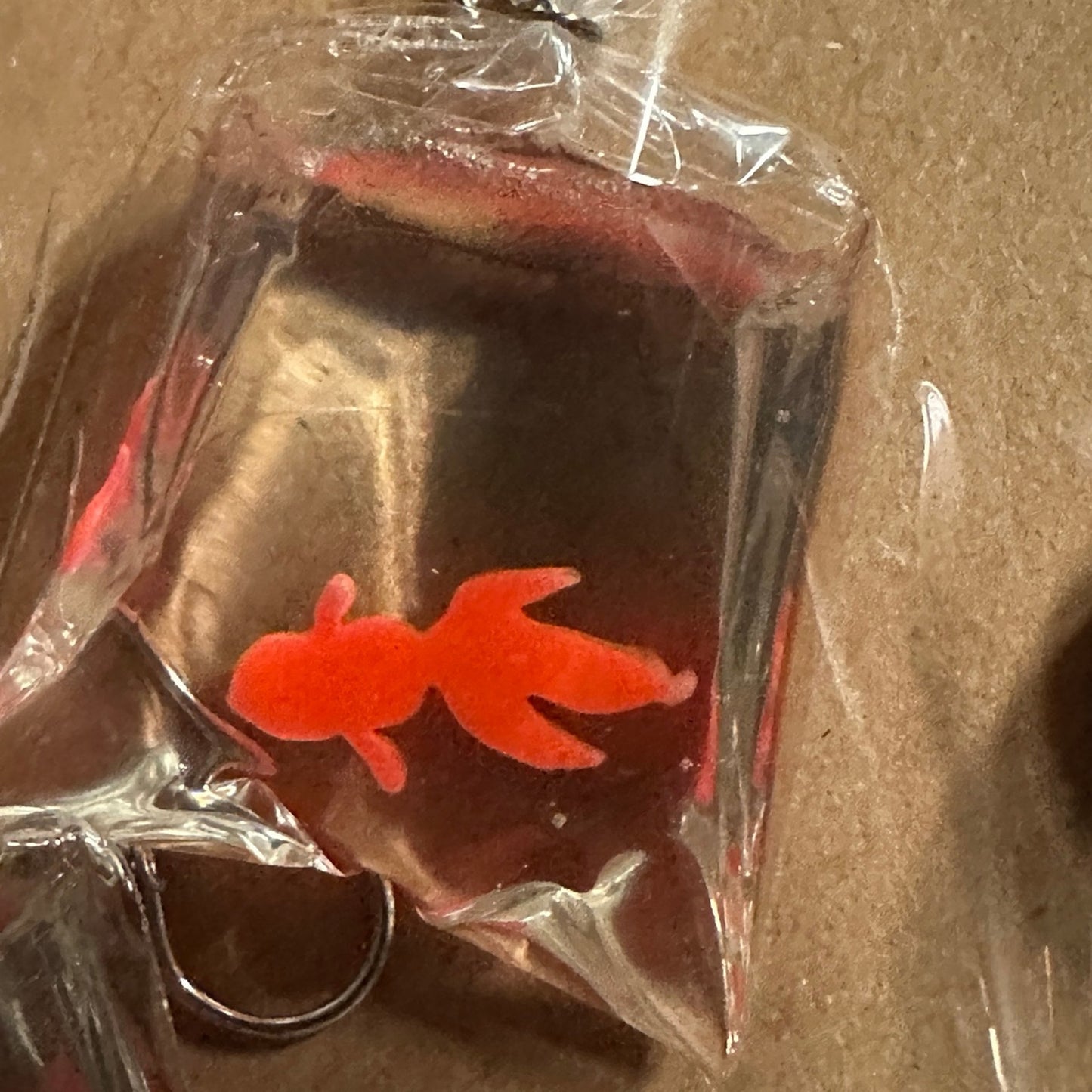 So cute dangling goldfish in a bag -