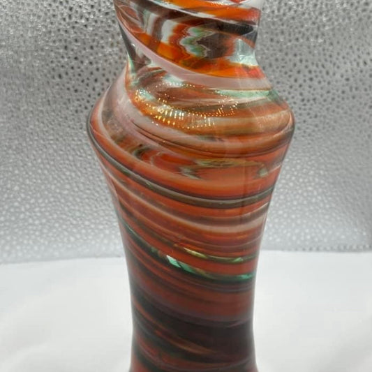 Beautiful hand blown swirl art glass vase. Measures 8x3