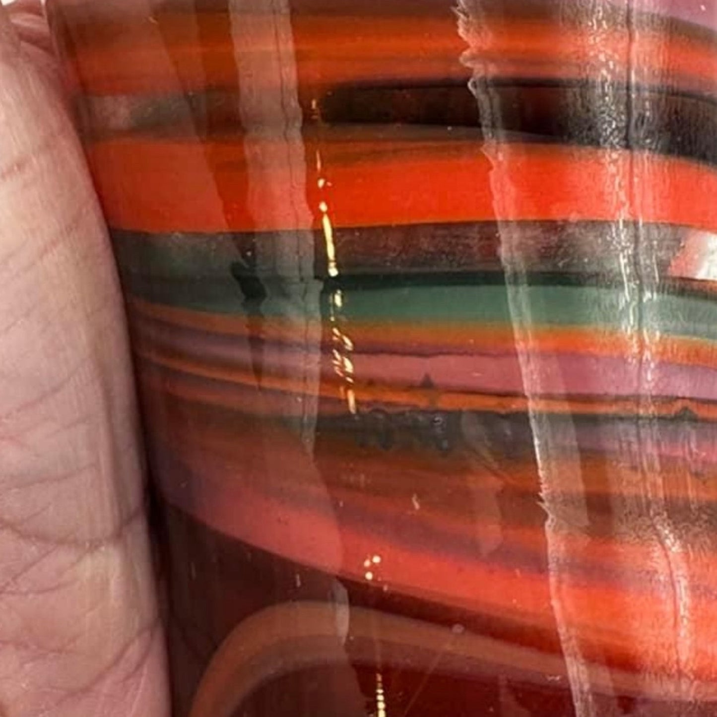 Beautiful hand blown swirl art glass vase. Measures 8x3